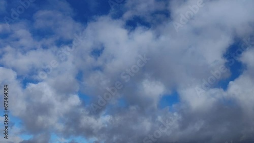 Early sky with golden-toned altocumulus clouds moving photo