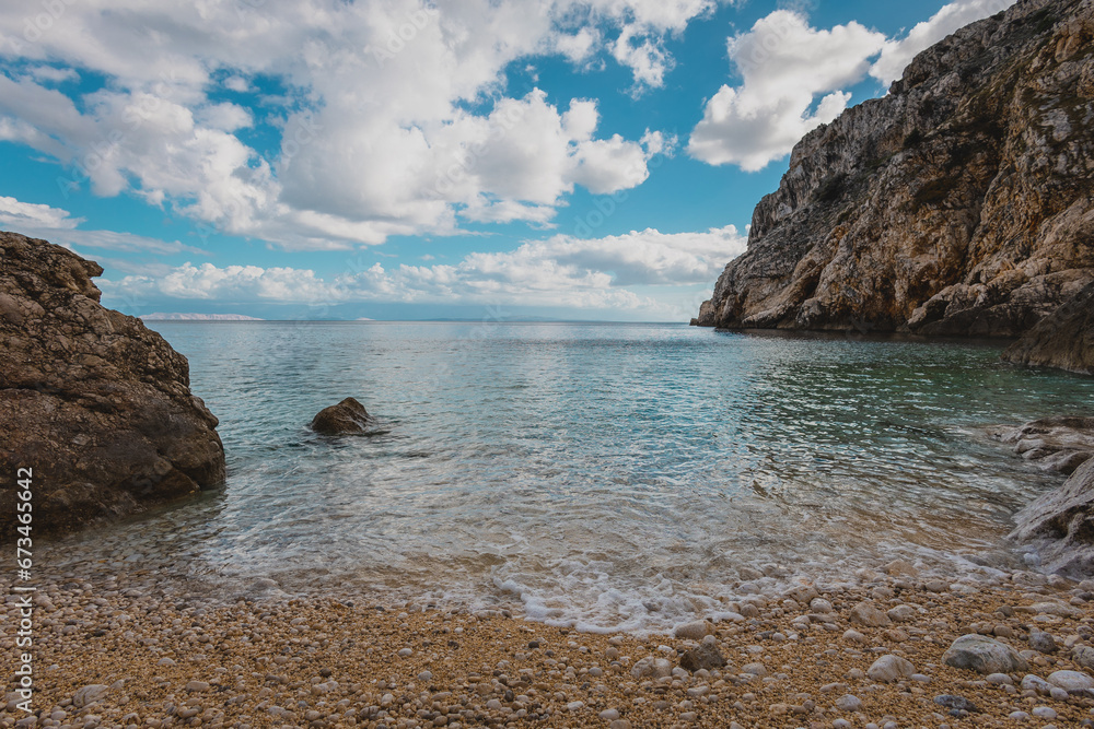 Beach of Mali Bok, close to the town of Orlec on the island of Cres, Croatia. Beautiful picturesque beach caught between two stone cliffs.
