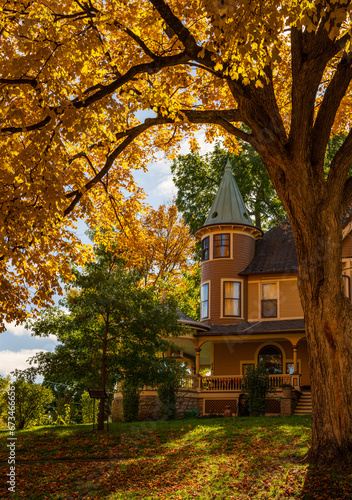 Ornate Victorian style home on W Broadway in Decorah Iowa with fall colors