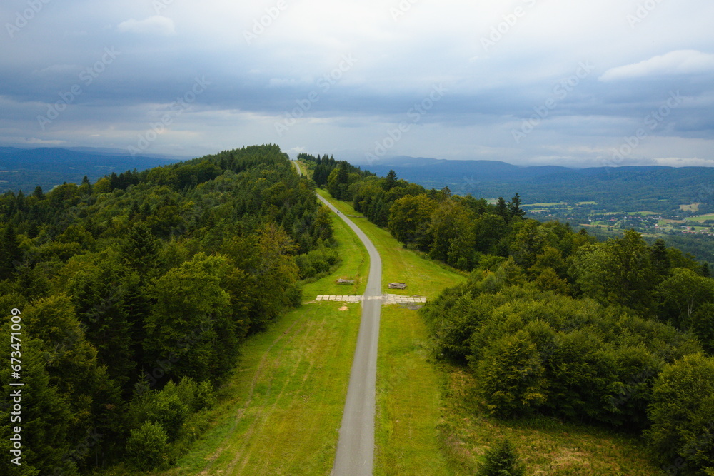 Narrow asphalt road in the middle of a mountain in the Bieszczady Mountains