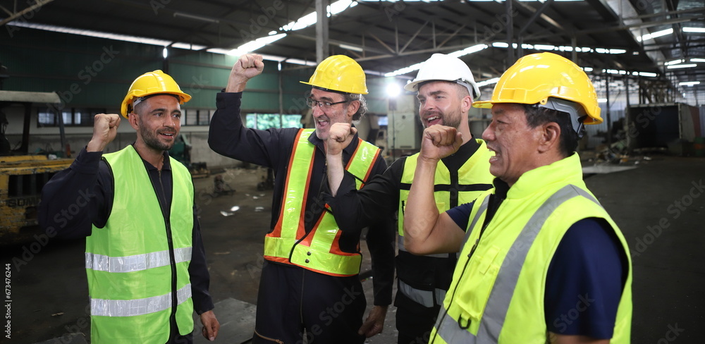 worker or engineer working in factory with safety uniform , safety hat and safety glasses , image is safety concept or happy workplace worker or engineer working in factory with safety uniform , safety hat and safety glasses , image is safety concept or happy workplace