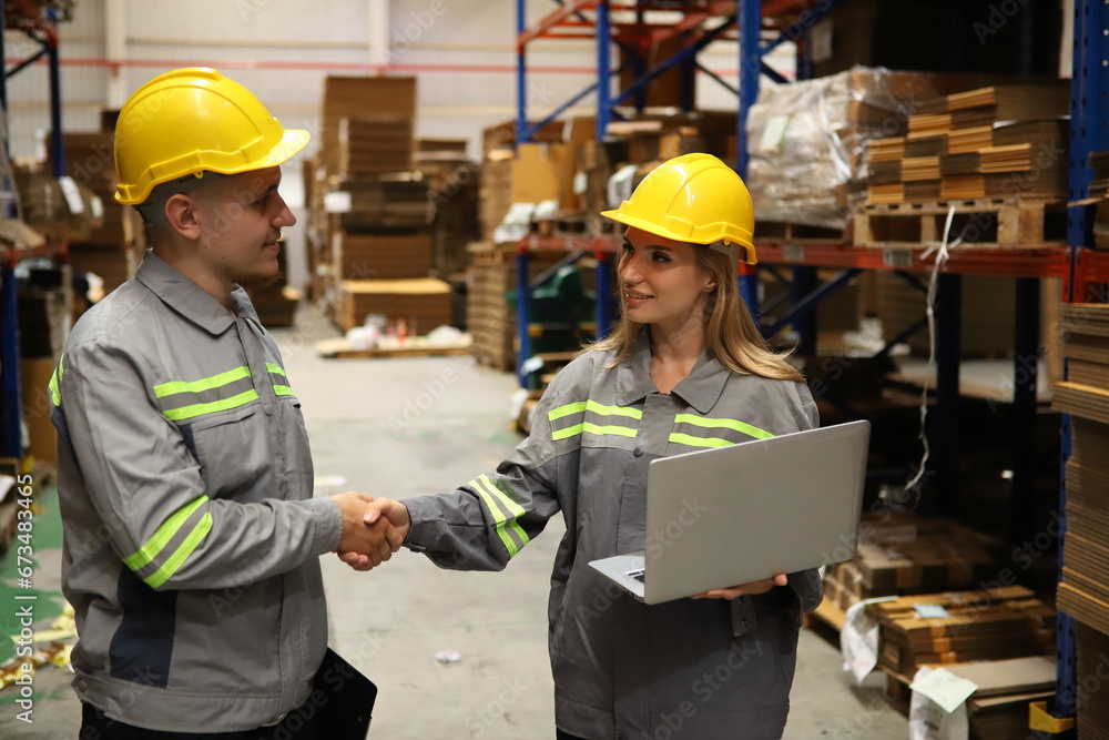 worker or engineer working in factory with safety uniform , safety hat and safety glasses , image is safety concept or happy workplace worker or engineer working in factory with safety uniform , safety hat and safety glasses , image is safety concept or happy workplace
