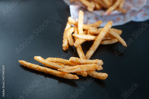 French fries in black background