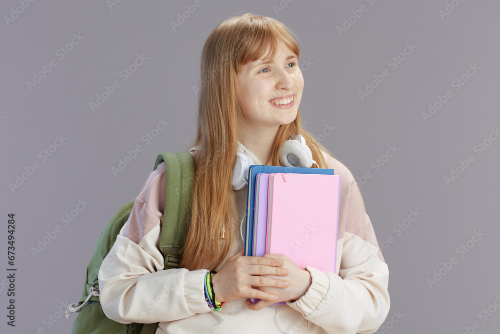 happy modern pupil in beige tracksuit with backpack happy modern pupil in beige tracksuit with backpack