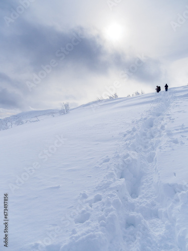 Two tourists on the top of snow-covered Mala Rawka.
