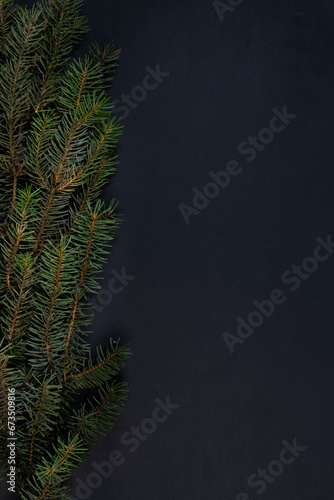 Fototapeta Naklejka Na Ścianę i Meble -  A Christmas tree, decorations on a black background. Top view.