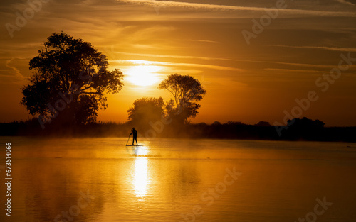 Great time for a workout paddle boarding on the delta river in Isleton Ca. in the early morning in fall autumn 