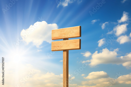 A wooden road sign with a clear blue and sunny sky in the background. Concept of motivational messages and quotes, positive thoughts.
