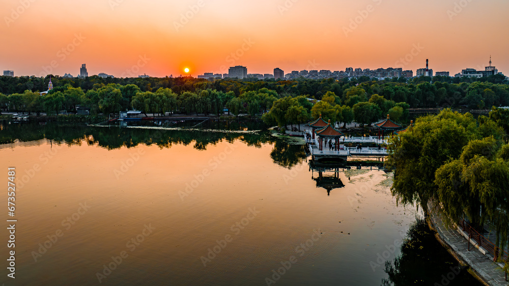 Scenery of Nanhu Park in Changchun, China under the setting sun