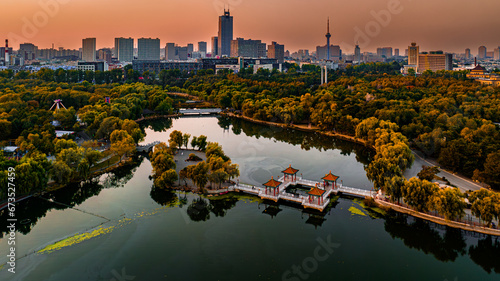 Scenery of Nanhu Park in Changchun, China under the setting sun