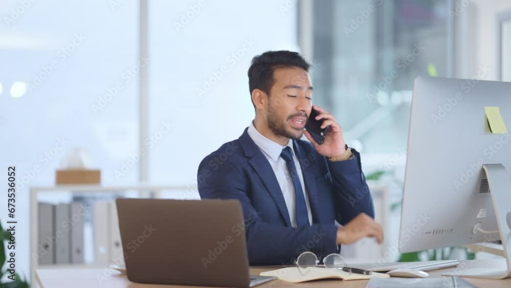Happy business man talking on his phone while working on a computer and smiling alone at work. Young corporate professional having a discussion and explaining project details to a colleague or client Happy business man talking on his phone while working on a computer and smiling alone at work. Young corporate professional having a discussion and explaining project details to a colleague or client
