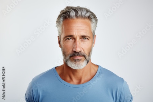 Portrait of a handsome middle-aged man with gray hair.