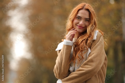 Autumn vibes. Portrait of beautiful woman outdoors. Space for text