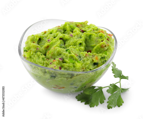 Bowl of delicious guacamole with parsley isolated on white