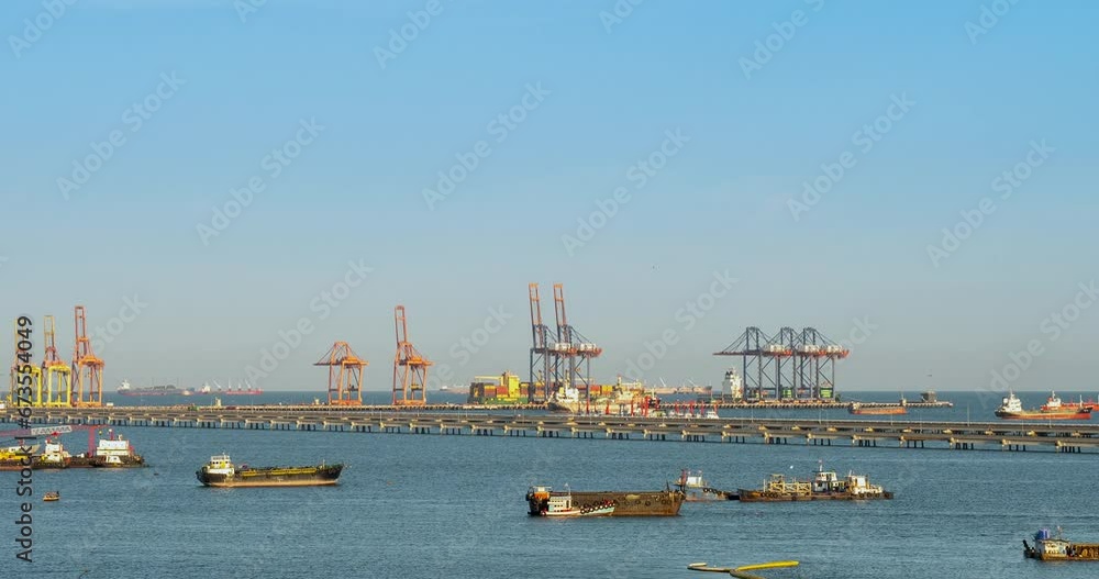 Engineering shipping crane depot at logistic export terminal control. Warehouse freight background container yard loading quayside harbor port. Logistics seascape shipping portal concept Engineering shipping crane depot at logistic export terminal control. Warehouse freight background container yard loading quayside harbor port. Logistics seascape shipping portal concept