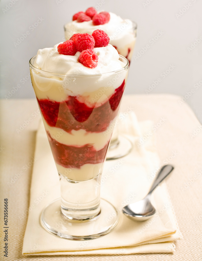 Fresh raspberry parfait with jam, custard and homemade whipped cream. Fresh raspberry parfait with jam, custard and homemade whipped cream.