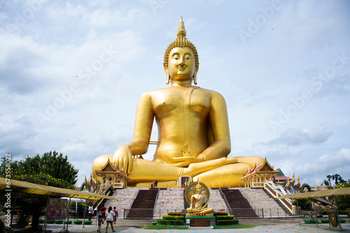 Ancient golden big buddha statue for thai people travelers travel visit and respect praying blessing wish holy mystery of Wat Muang temple at Angthong city on October 31  2023 in Ang Thong  Thailand
