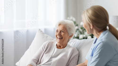 Caregiver nurse accompanying elderly woman, retirement photo