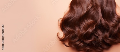 A view from the top of a background with a brown wave like lock of hair photo