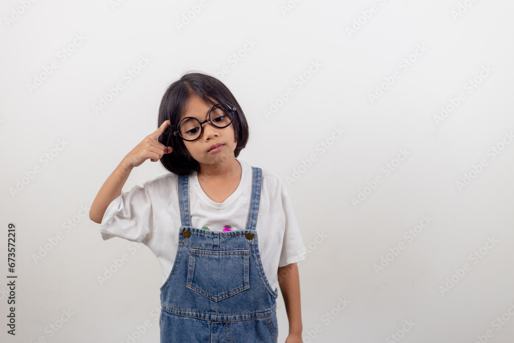 funny Asian child girl wearing glasses on a white background funny Asian child girl wearing glasses on a white background