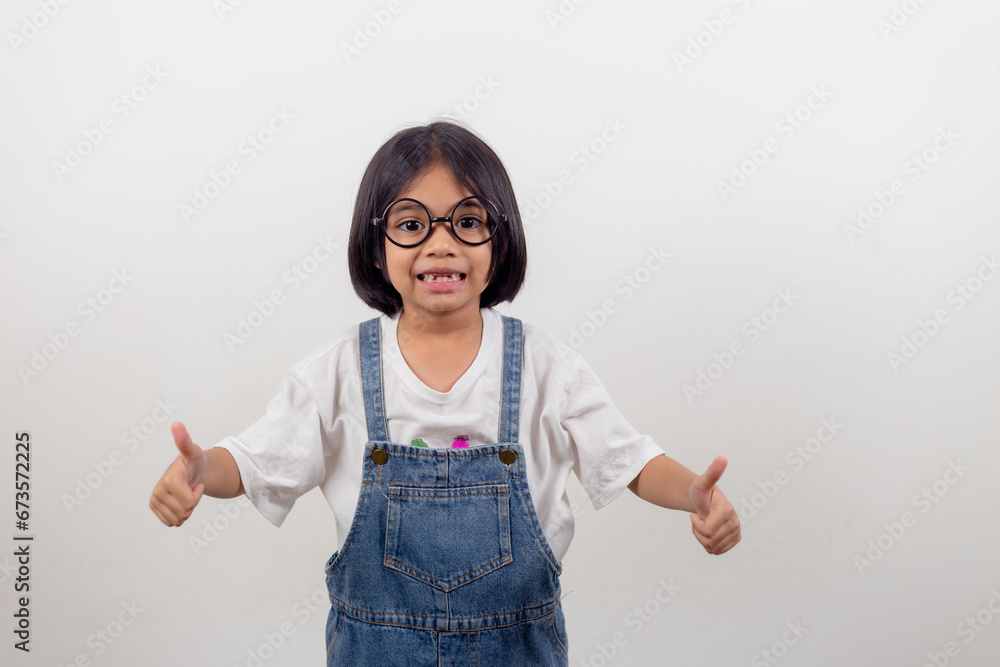 funny Asian child girl wearing glasses on a white background funny Asian child girl wearing glasses on a white background