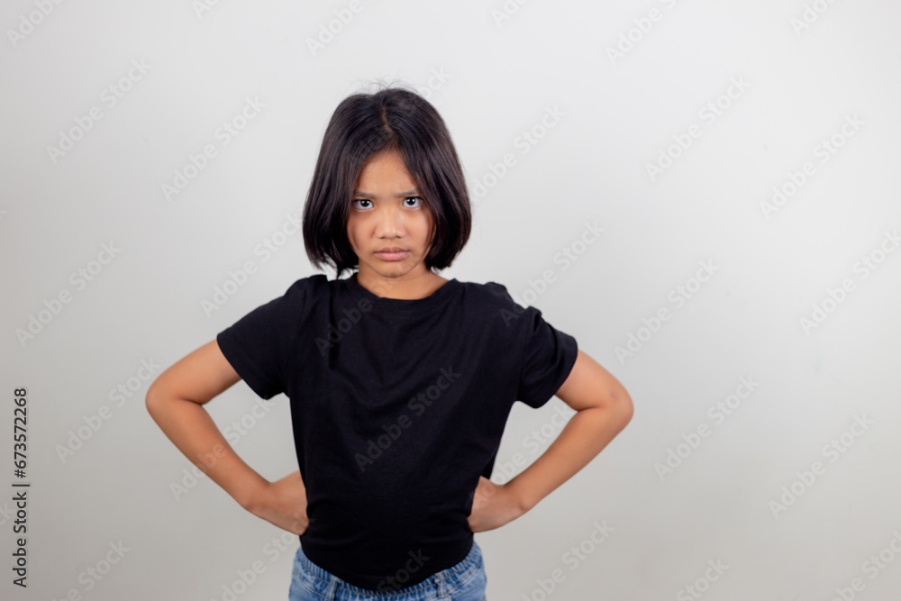 Angry little girl over white background, sign and gesture concept Angry little girl over white background, sign and gesture concept