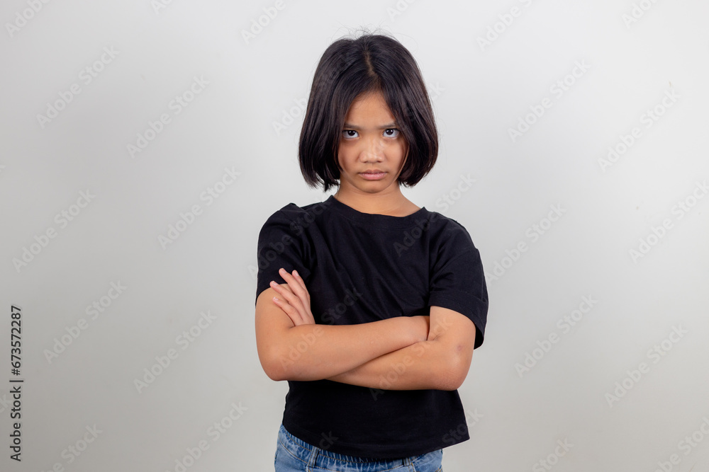 Angry little girl over white background, sign and gesture concept Angry little girl over white background, sign and gesture concept