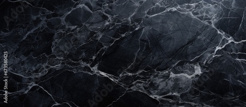 Abstract background featuring a black marble texture embracing the concept of realistic materials and interior design on a stone surface