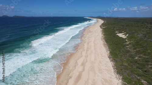 Aerial View Of Waves Over Sand Dunes In Mungo Beach, New South Wales, Australia. photo