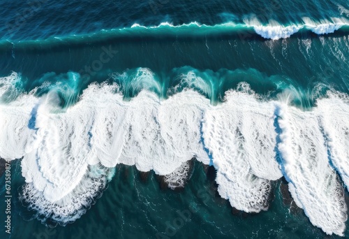 Aerial view of a spectacular ocean with white waves splashing