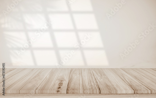Minimalistic abstract gentle light beige background for product presentation with light and shadow of window and leaf curtains on wall. Pastel cream watercolor concrete wall old on floor wood parquet.