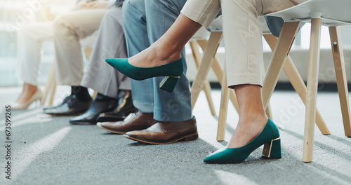 Closeup, business people and shoes with feet, job interview waiting room and nervous with opportunity. Row, group and candidates with recruitment with heels, footwear and hiring in a workplace photo