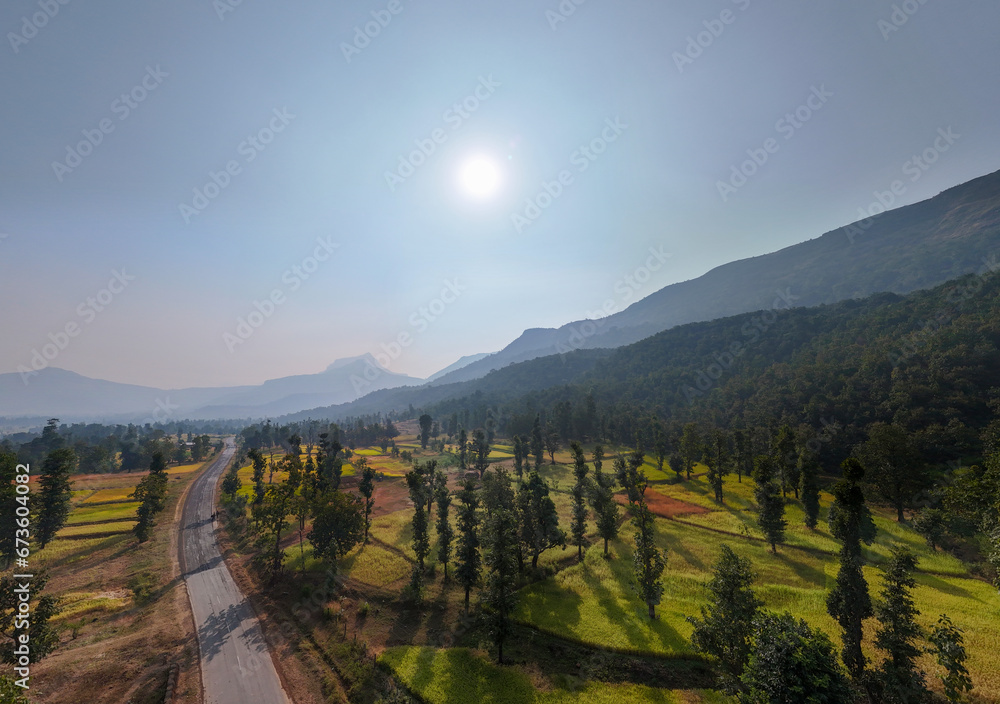 Beautiful Aerial panorama of mountain in forest with road passing through mountain.