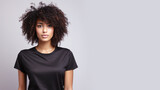 Afro american woman wearing black t-shirt isolated on gray background