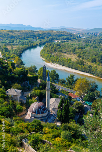 Bosnia and Herzegovina, village with mosque and turquoise river- pocitelj photo