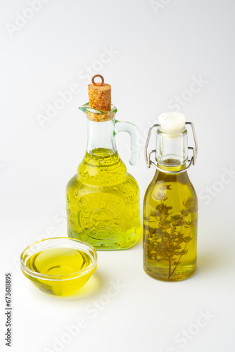 Bottles of two cooking oils on white background