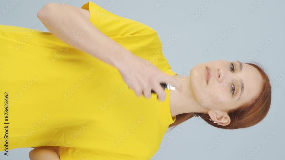 Vertical video of Woman spraying perfume, good smell. Vertical video of Woman spraying perfume, good smell.