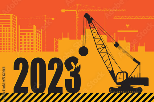 Tractor excavator with a ball-baba at work at a construction site. New Year card, 2024.