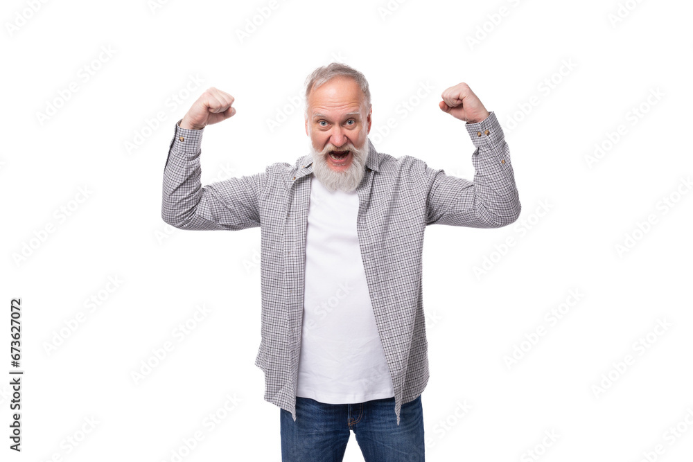 well-groomed gray-haired senior man with a beard and mustache feels healthy well-groomed gray-haired senior man with a beard and mustache feels healthy