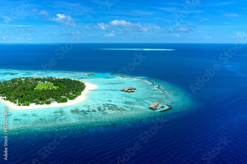Aerial Shot of Island Surrounded by Blue Sea