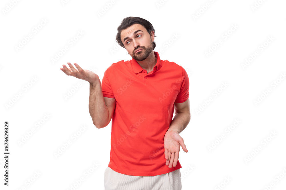 Naklejka premium young handsome european brunette man with a beard dressed in a red t-shirt is brainstorming to solve a problem