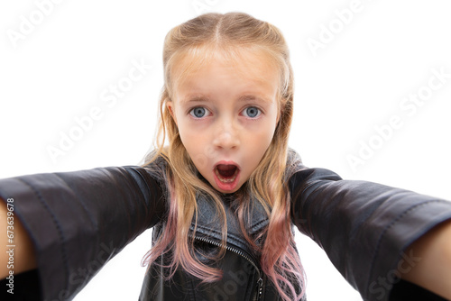 Portrait of wondered five year old girl reaching hands forward to the camera isolated on white background. Cute blonde child with open mouth posing in studio. Human facial expressions and emotions. photo