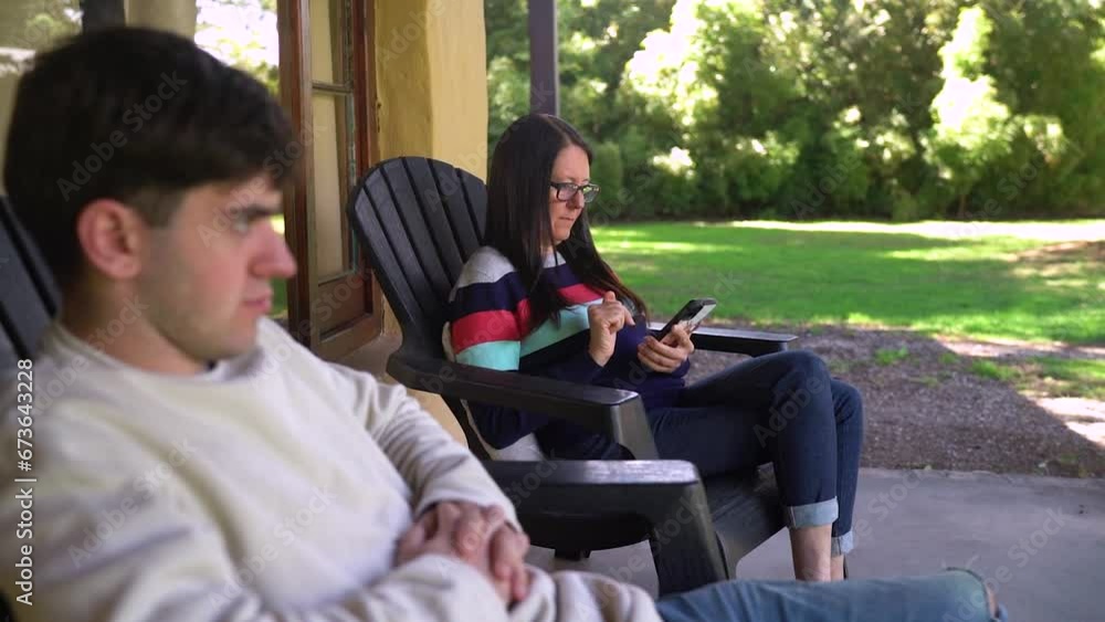 A Mom Relaxing with her Son While Using a Mobile Device - Close Up A Mom Relaxing with her Son While Using a Mobile Device - Close Up