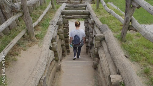 Wallpaper Mural A Lady Descending the Staircase in Biskupin, Poland - Close Up Torontodigital.ca