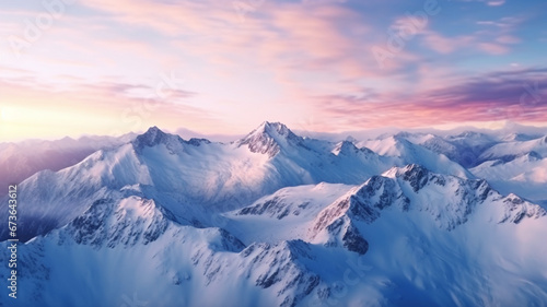 Dawn over snow-capped mountain peaks.