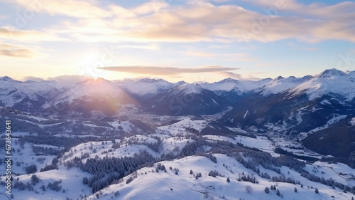 Dawn over snow-capped mountain peaks.