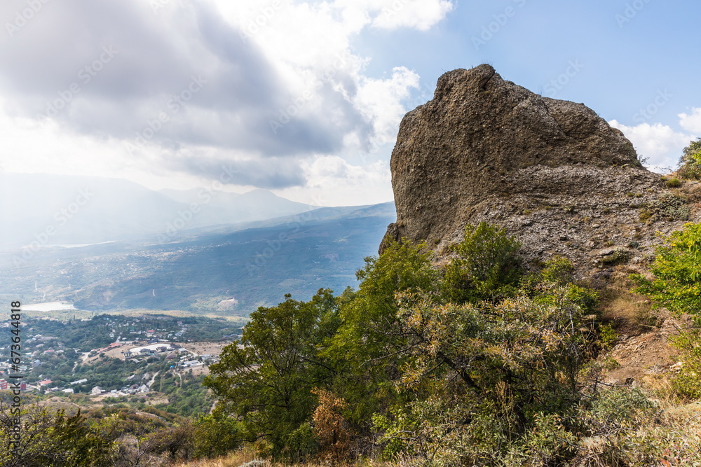 Fototapeta premium Mysterious mountain landscape of the Valley of Ghosts, a cluster of strangely shaped rocks on the western slope of Mount Demerdzhi in Crimea