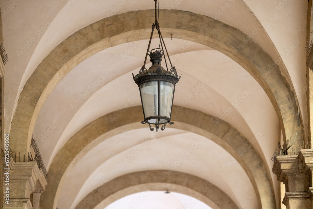 Old wall street lighting in the old town of Bologna. Italy
