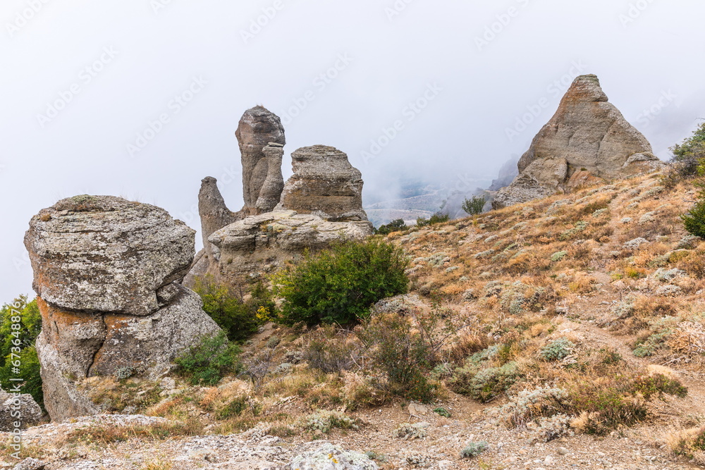 Mysterious mountain landscape of the Valley of Ghosts, a cluster of strangely shaped rocks on the western slope of Mount Demerdzhi in Crimea Mysterious mountain landscape of the Valley of Ghosts, a cluster of strangely shaped rocks on the western slope of Mount Demerdzhi in Crimea