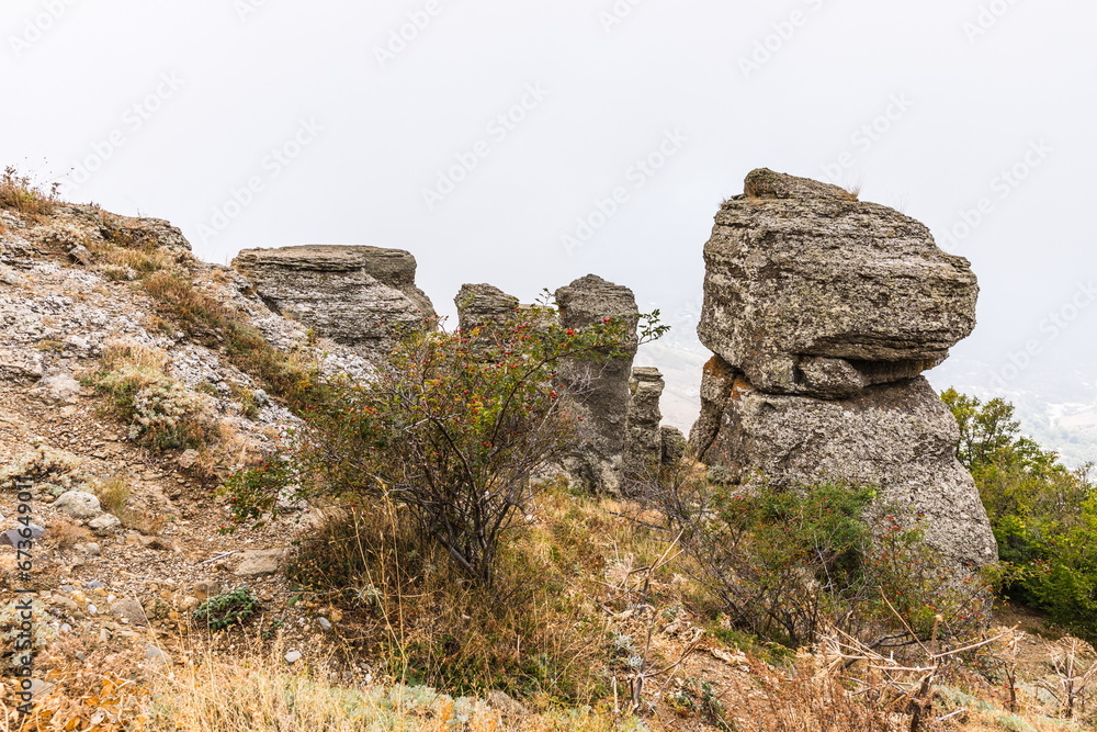 Mysterious mountain landscape of the Valley of Ghosts, a cluster of strangely shaped rocks on the western slope of Mount Demerdzhi in Crimea Mysterious mountain landscape of the Valley of Ghosts, a cluster of strangely shaped rocks on the western slope of Mount Demerdzhi in Crimea